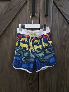 Mini Boden Navy Swim Trunks with Multicolor Animal Print